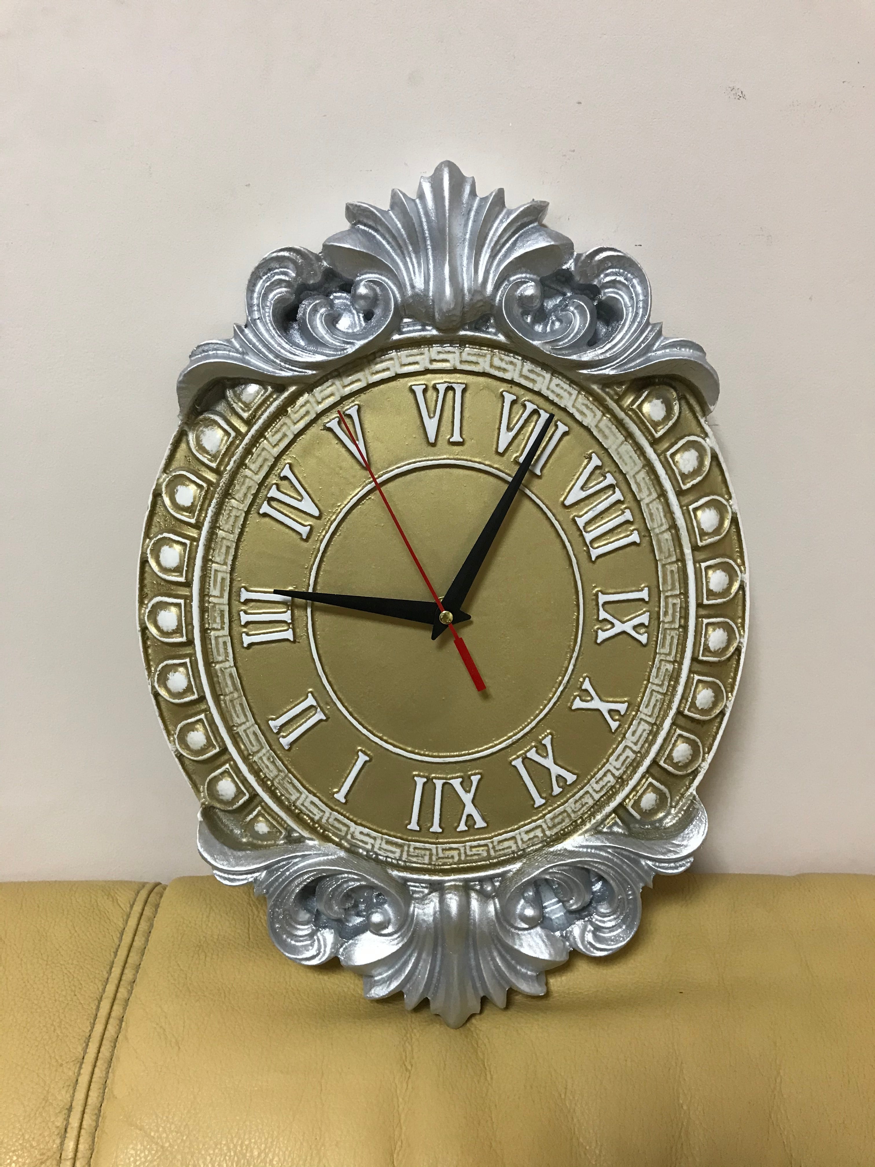 Ornate baroque wall clock with Roman numerals in gold and silver finish, decorative classic clock for luxury interior