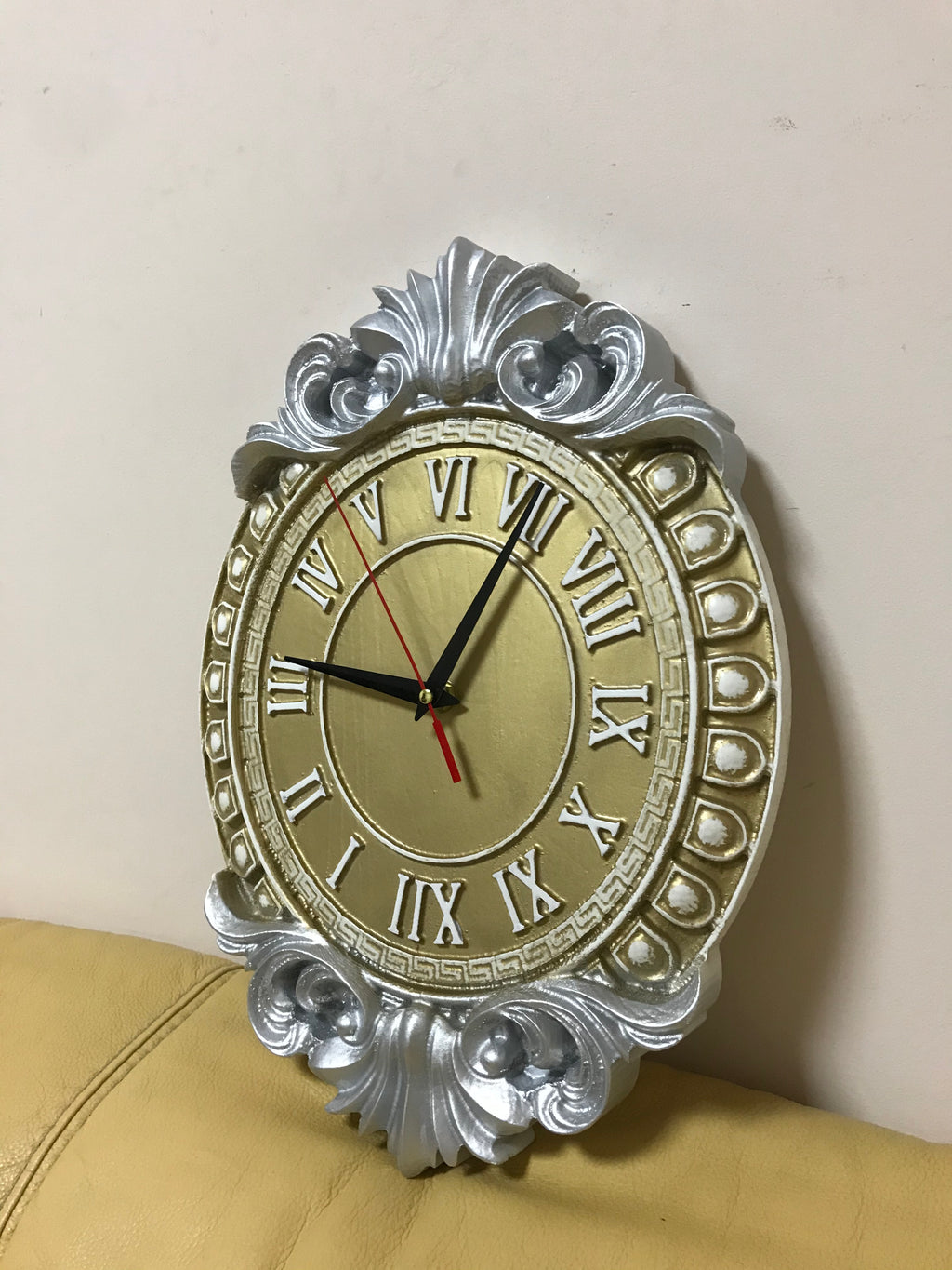 Decorative baroque wall clock with Roman numerals and carved silver frame, classic luxury wall decor