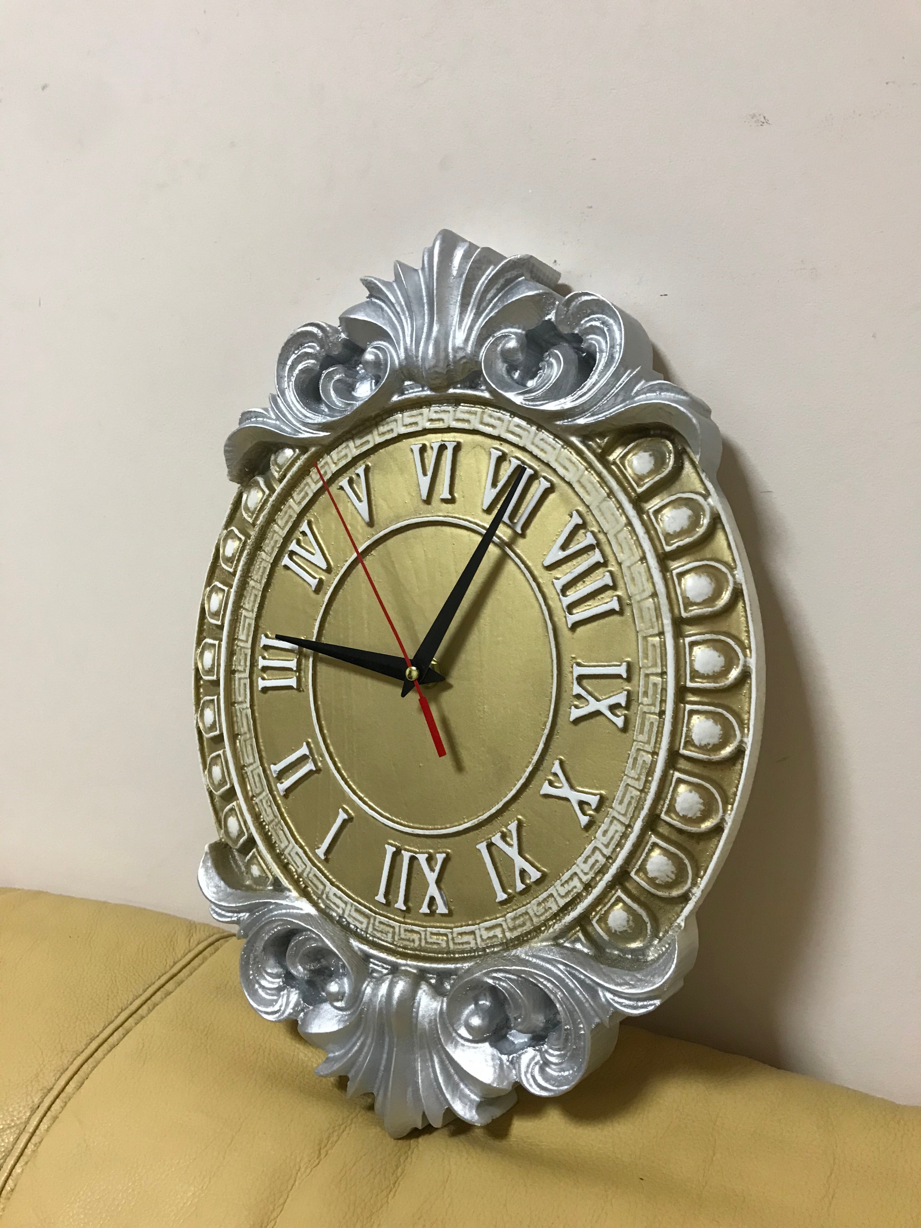 Decorative baroque wall clock with Roman numerals and carved silver frame, classic luxury wall decor