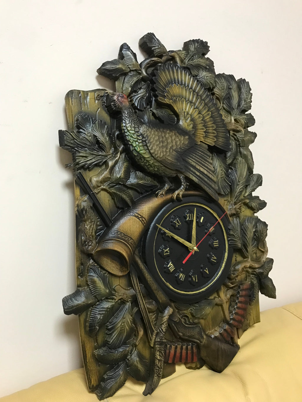 Carved ash wood wall clock with capercaillie bird shown at angle, rustic hunting wall decor