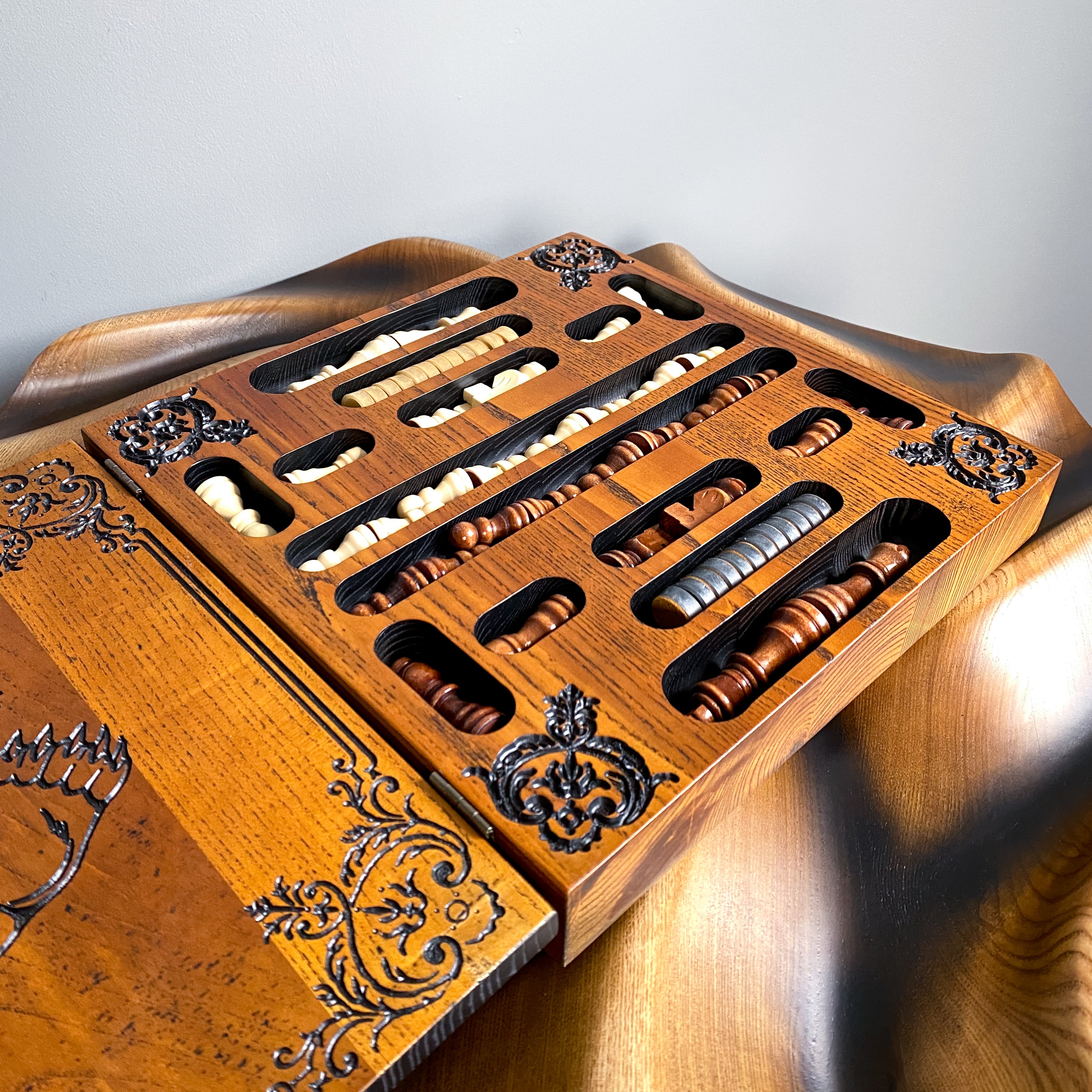 Inside view of wooden chess and checkers box with storage compartments