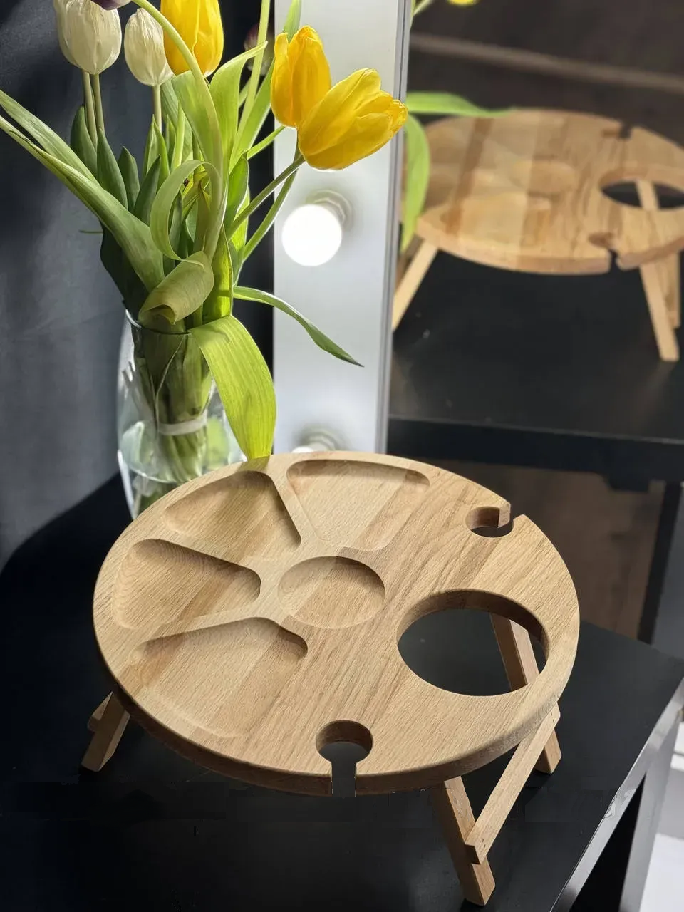 Round wooden wine table with bottle holder and snack compartments made from solid oak