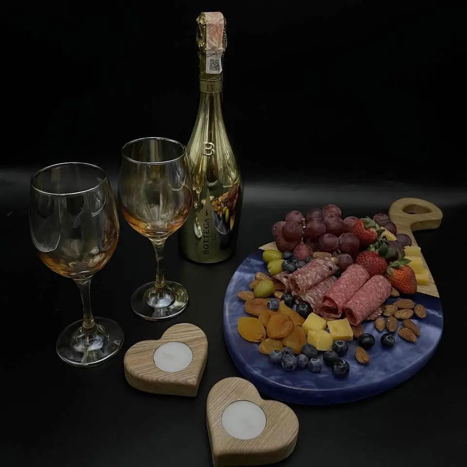 Wooden cheese board set with blue epoxy resin for serving appetizers