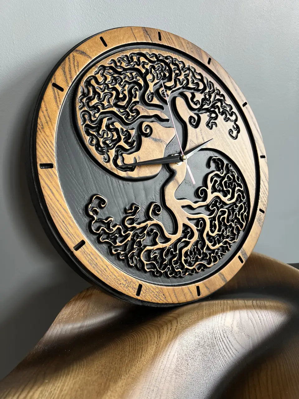 Close up of Tree of Life carved wooden clock showing detailed wood carving