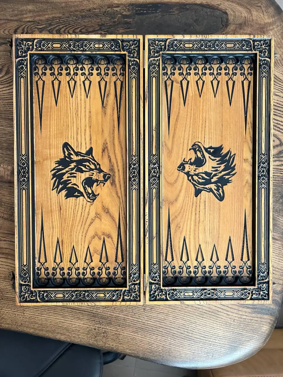 Back view of handcrafted wolf-themed wooden backgammon set