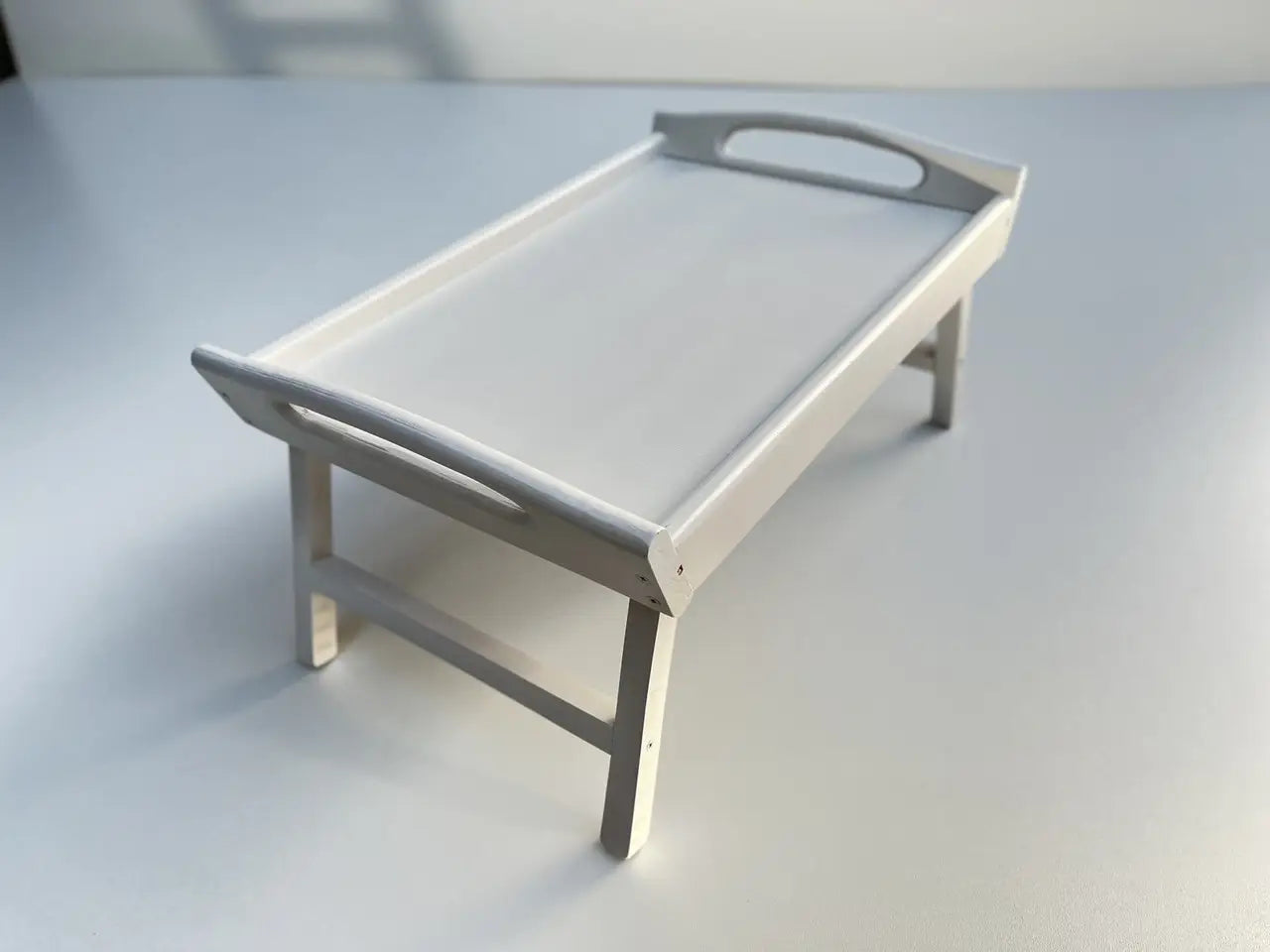 White wooden serving tray close-up detail