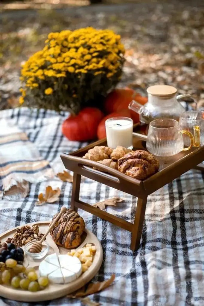 Wooden breakfast-in-bed tray with foldable legs in brown color