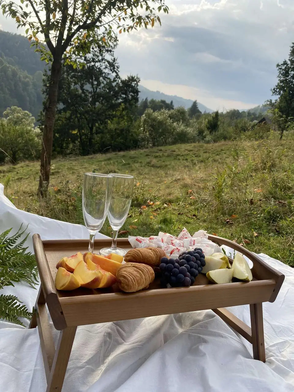 Foldable wooden serving tray with legs, top view