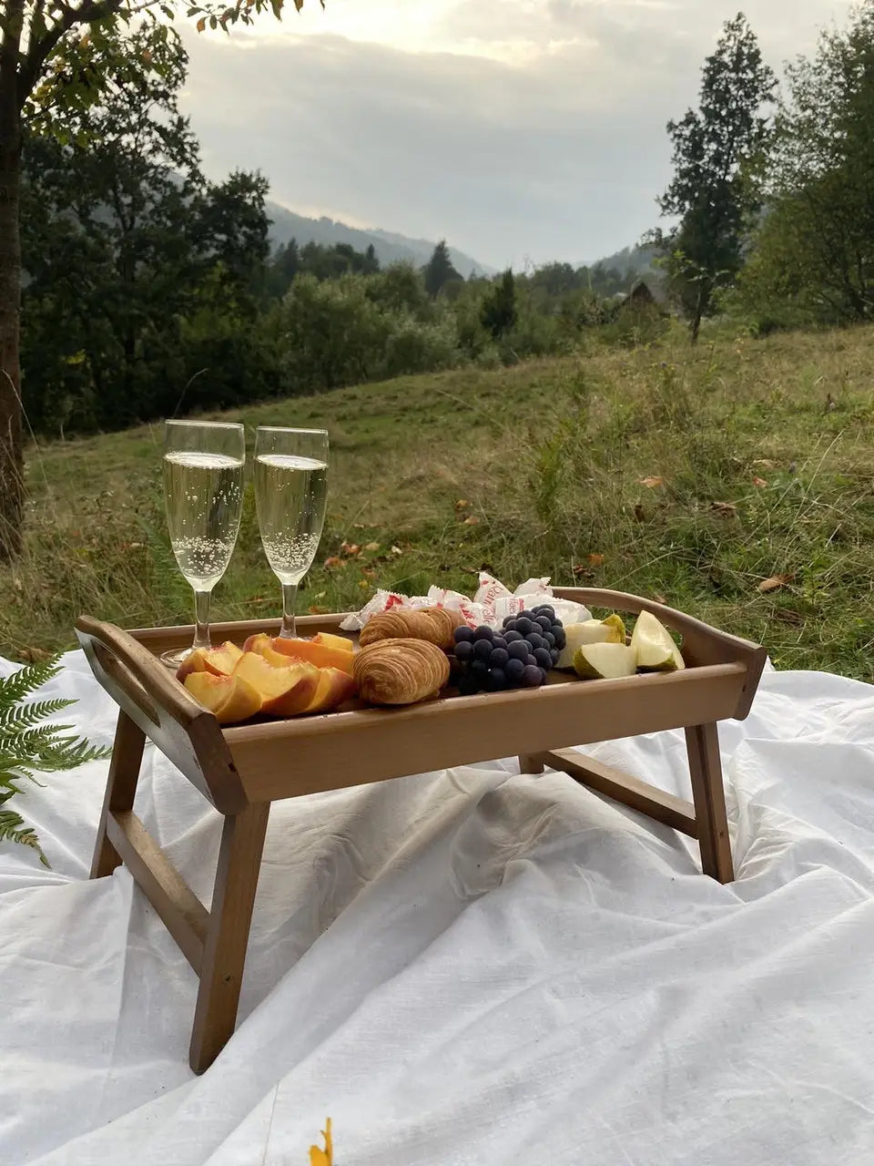 Brown wooden bed tray used for breakfast and coffee