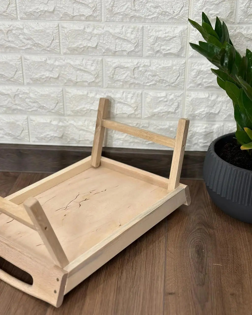 Wooden breakfast tray underside with folded legs