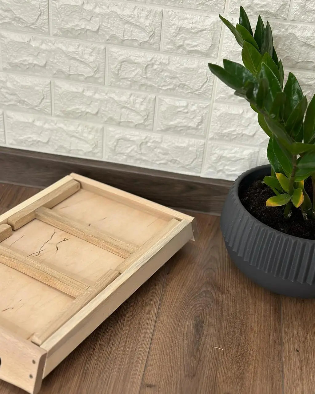 Breakfast tray with black base and wooden legs folded