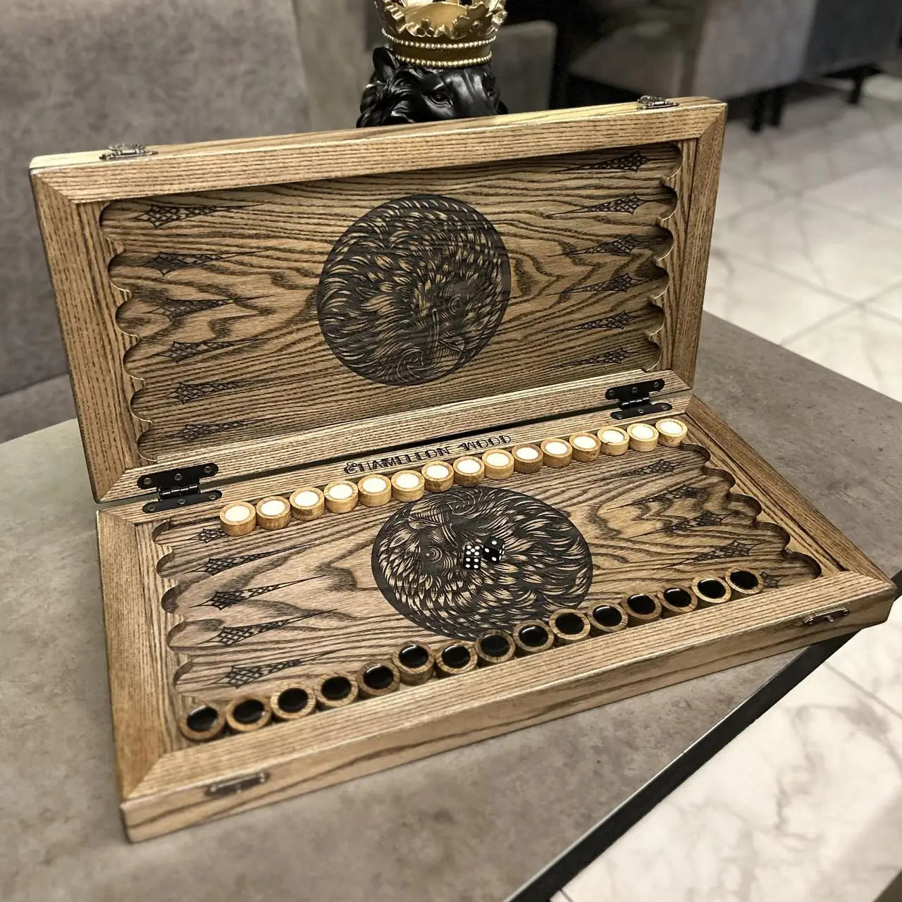 Wooden playing pieces inside handmade Eagle backgammon set