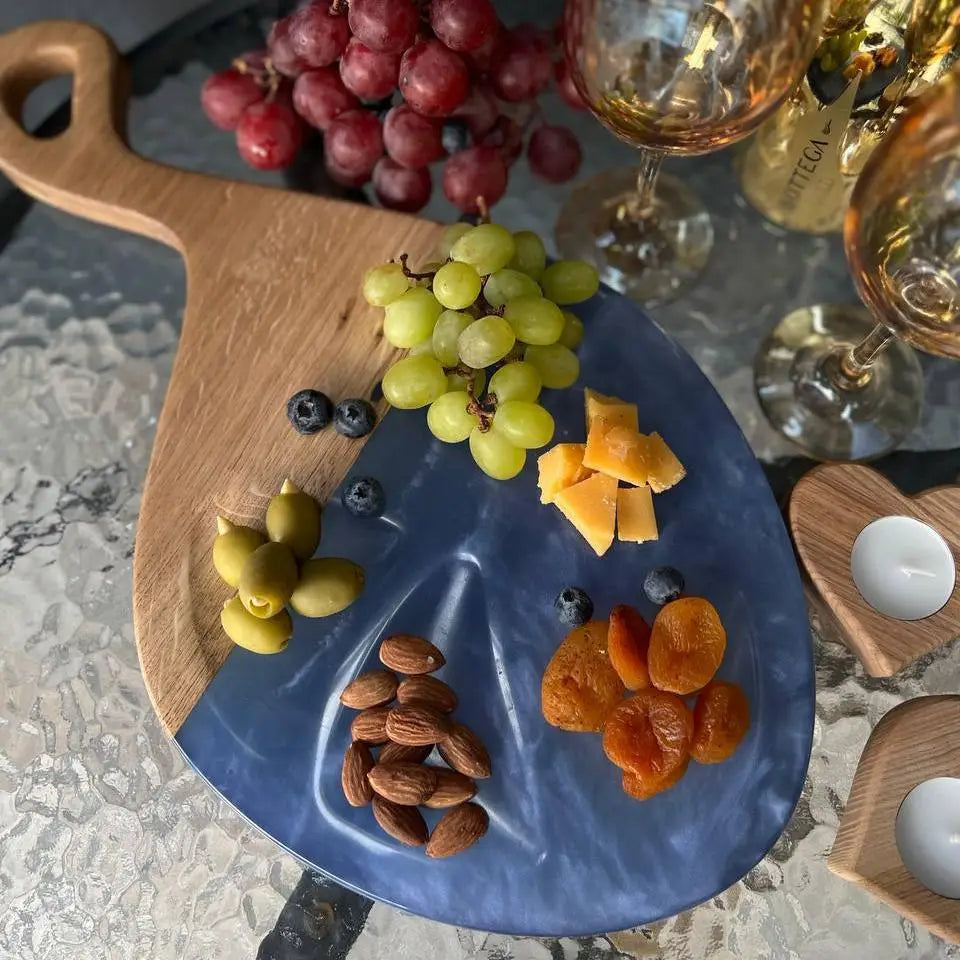 Artisan wooden serving tray made from oak and blue epoxy resin for entertaining guests