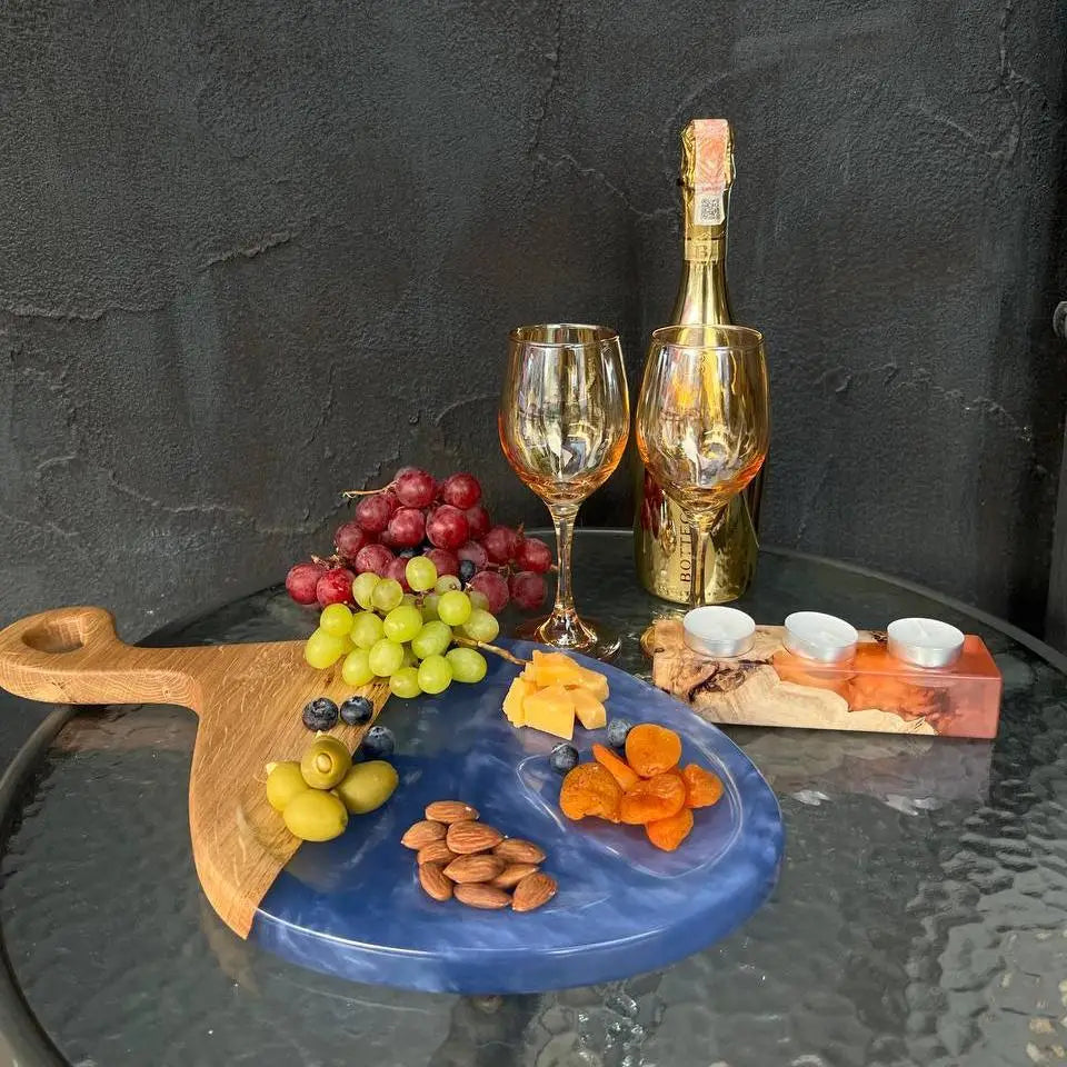 Handcrafted oak cheese board with pearl blue epoxy resin for wine and charcuterie presentation