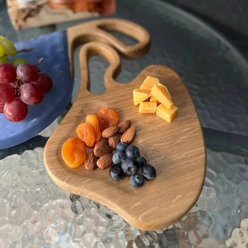 Wooden cheese board set with blue epoxy resin for charcuterie and serving
