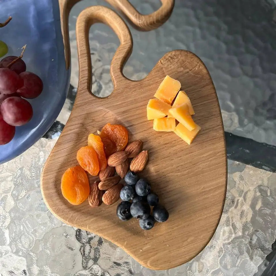 Handmade wooden cutting board set with blue epoxy resin and natural wood grain