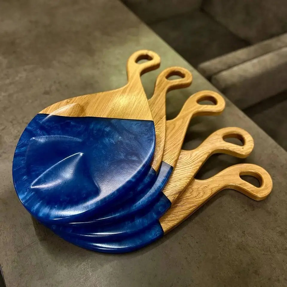 Decorative wooden charcuterie board with epoxy resin handmade from natural oak wood