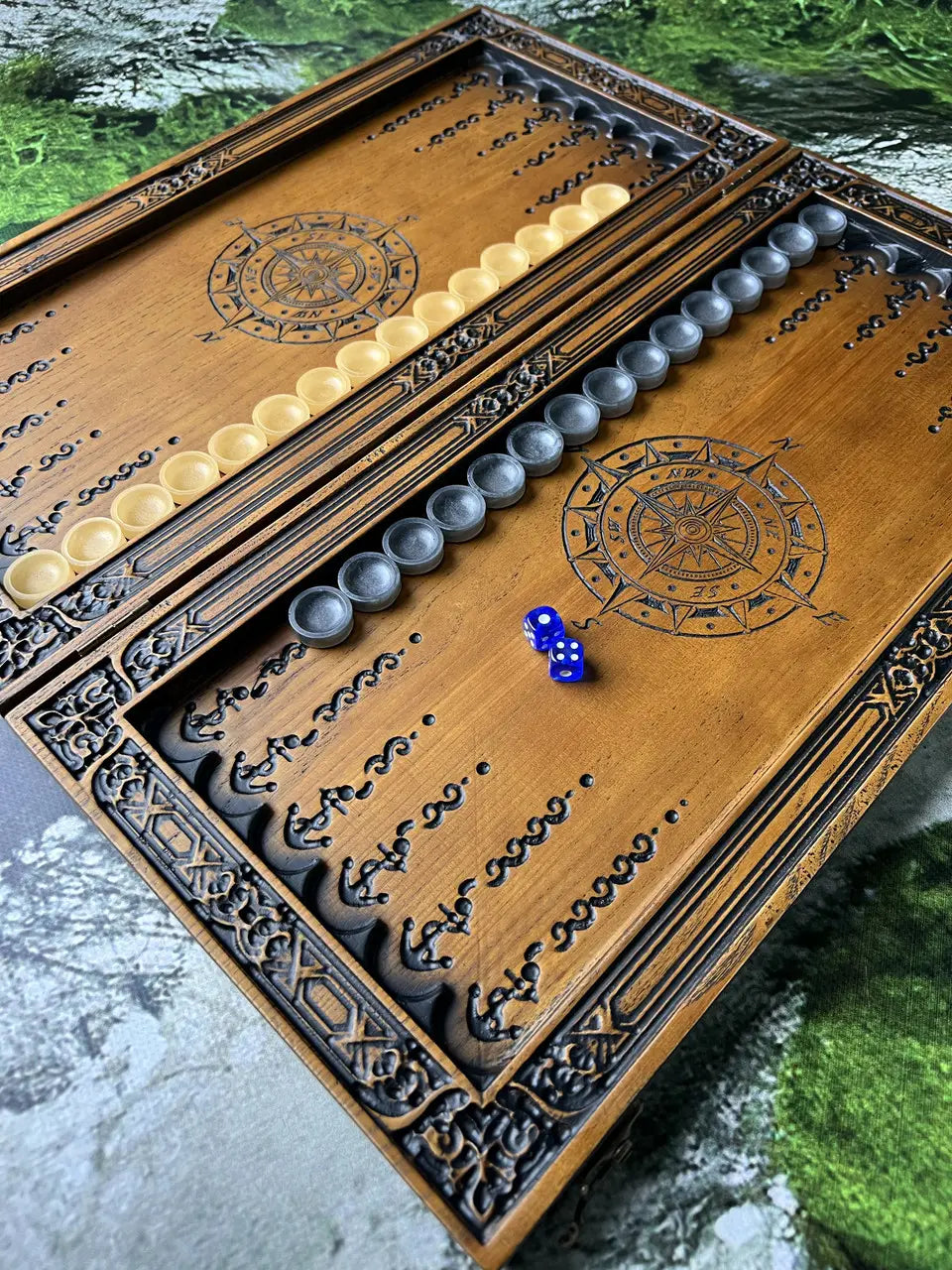 Side view of handmade wooden backgammon board with Kraken design