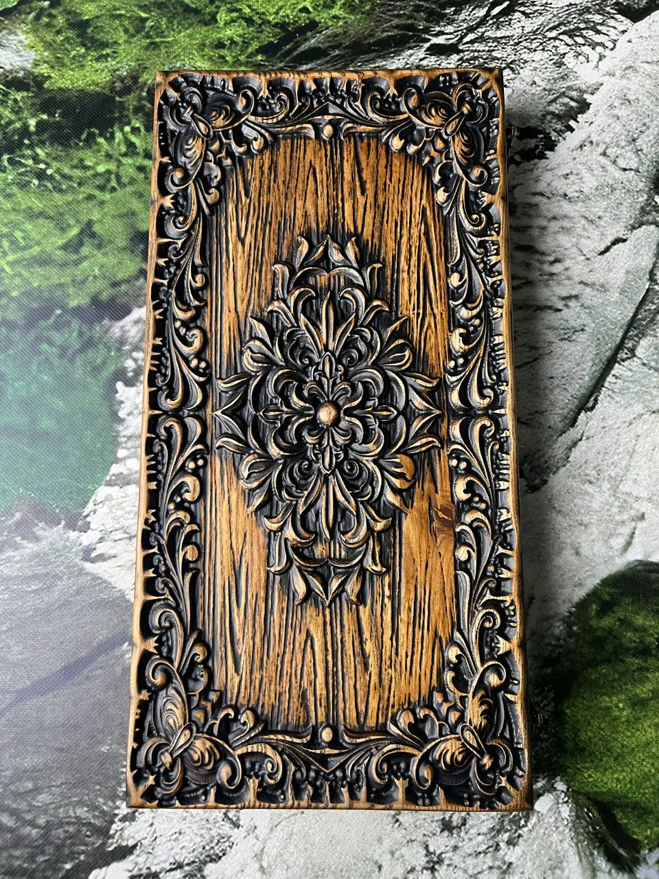 Hand-carved royal ornament on handmade wooden backgammon case