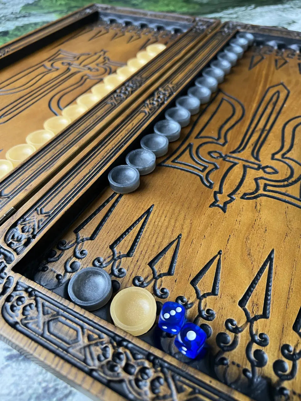 Handmade Bogatyr backgammon board displayed with resin checkers