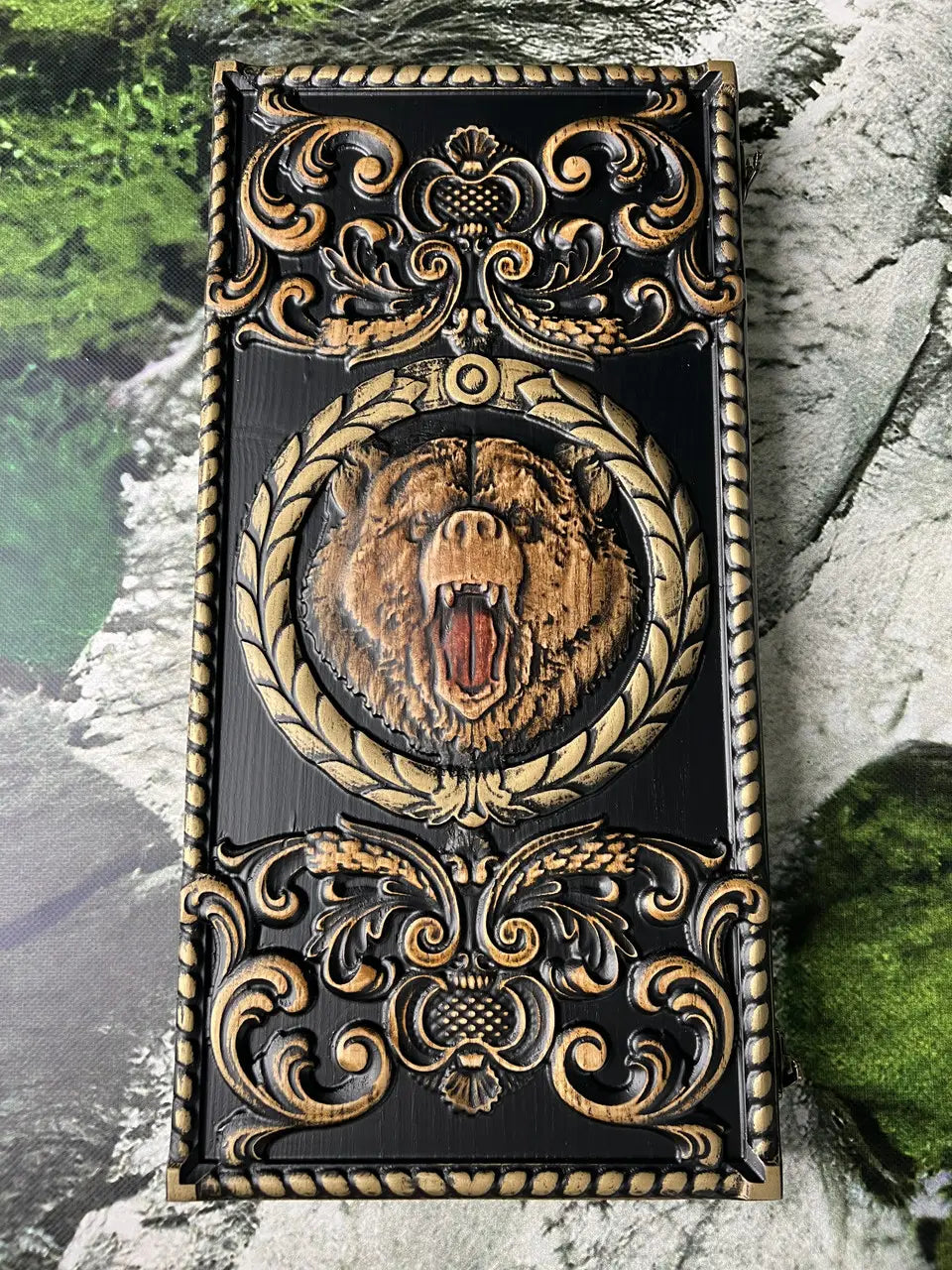 Detailed bear carving on handcrafted wooden backgammon board