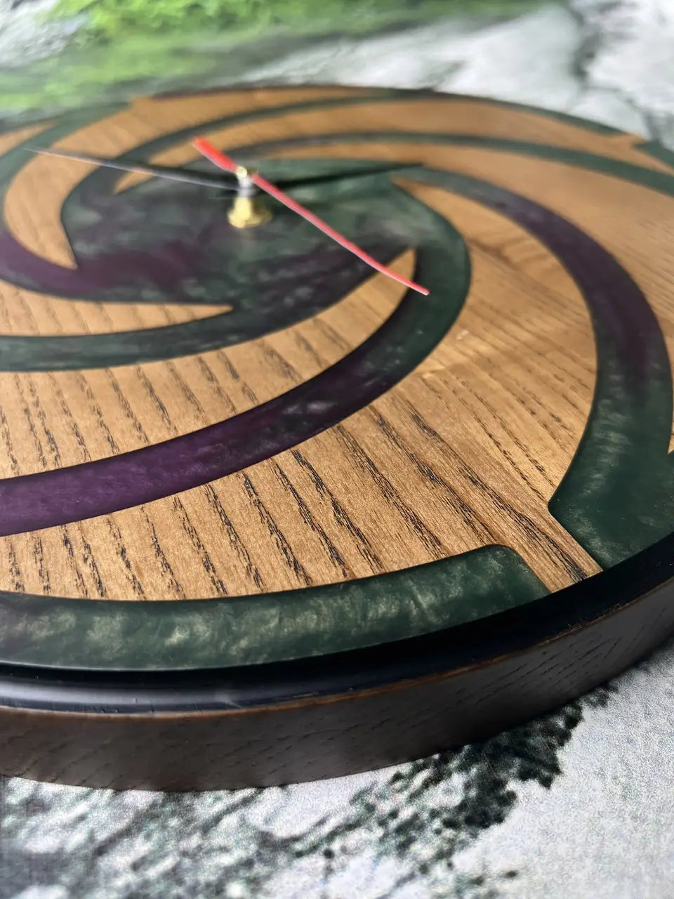Handmade Wood Clocks featuring natural wood grain and dark epoxy swirl