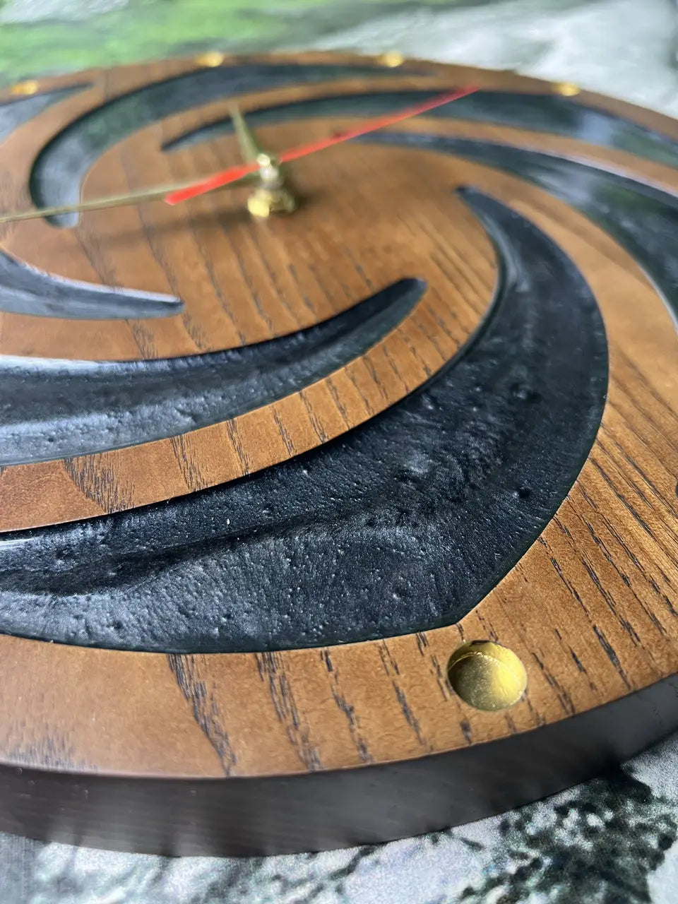 Round Wood Frame Wall Clocks featuring a modern black spiral pattern