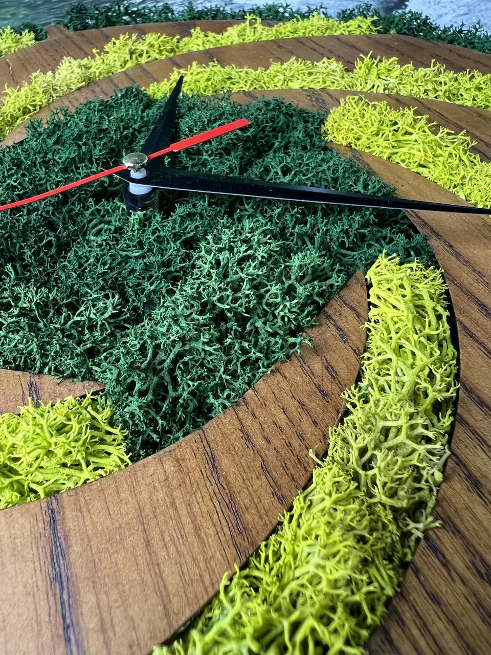 Wood frame wall clocks with spiral wooden and moss pattern
