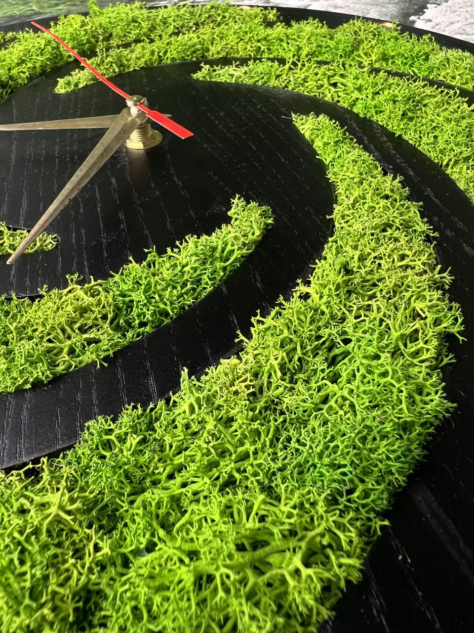 Wooden wall clocks with bright green preserved moss