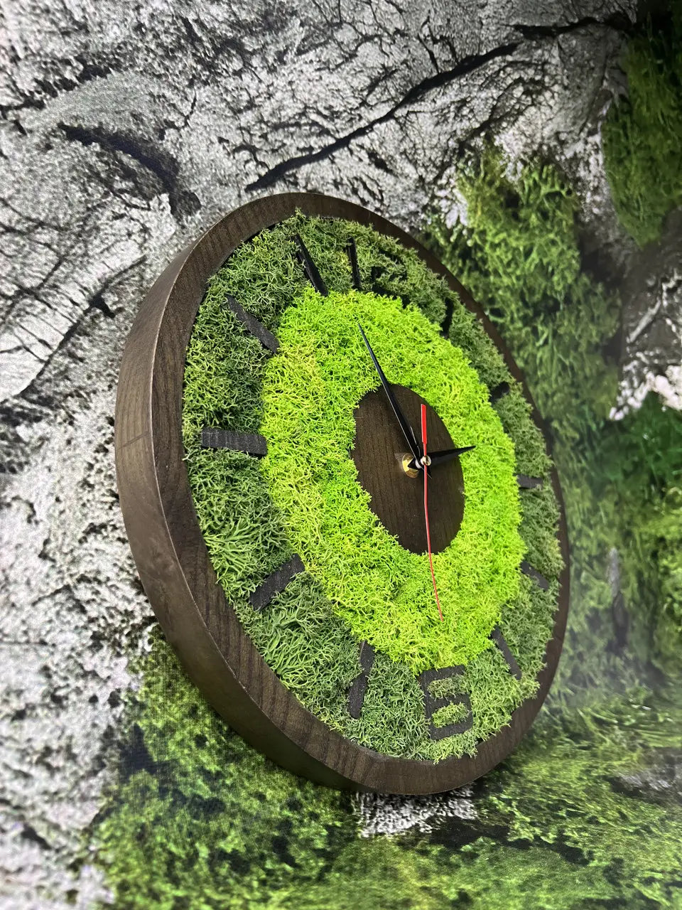 Wooden wall clock with green moss ring and dark wood center