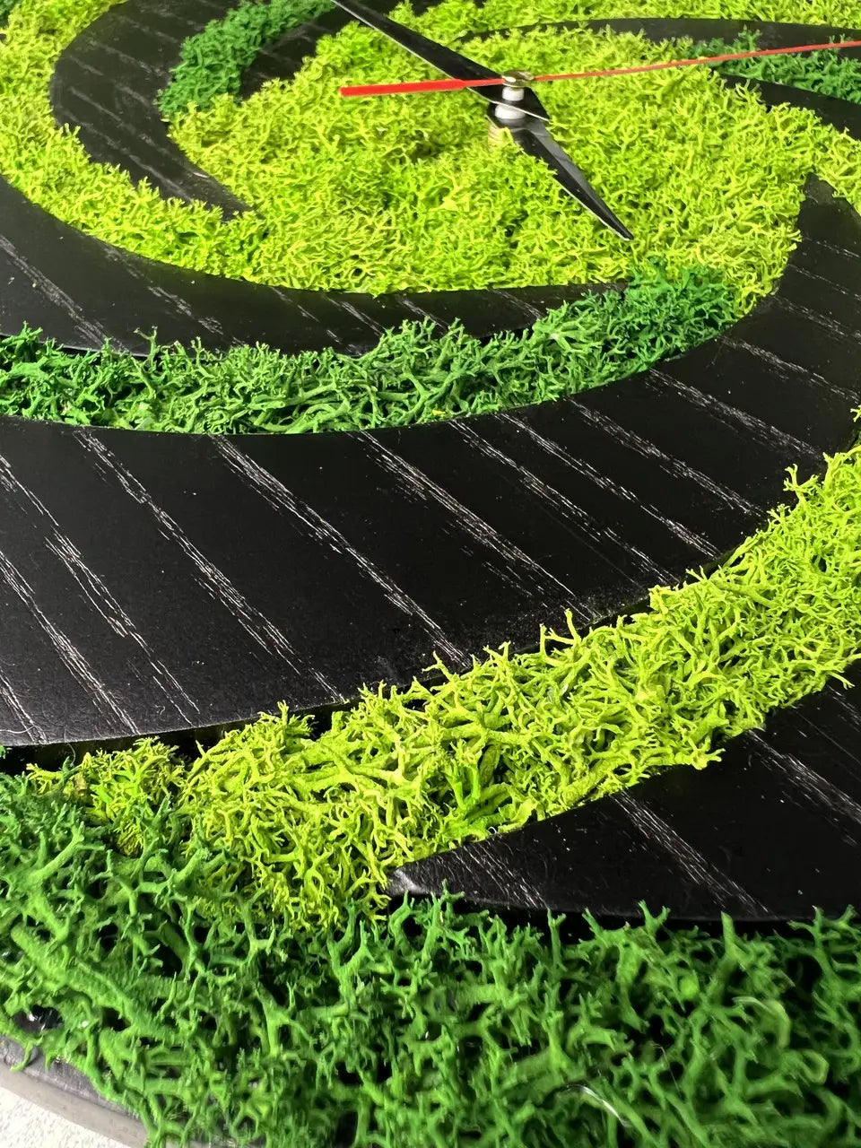 Wood frame wall clocks featuring natural green moss decor