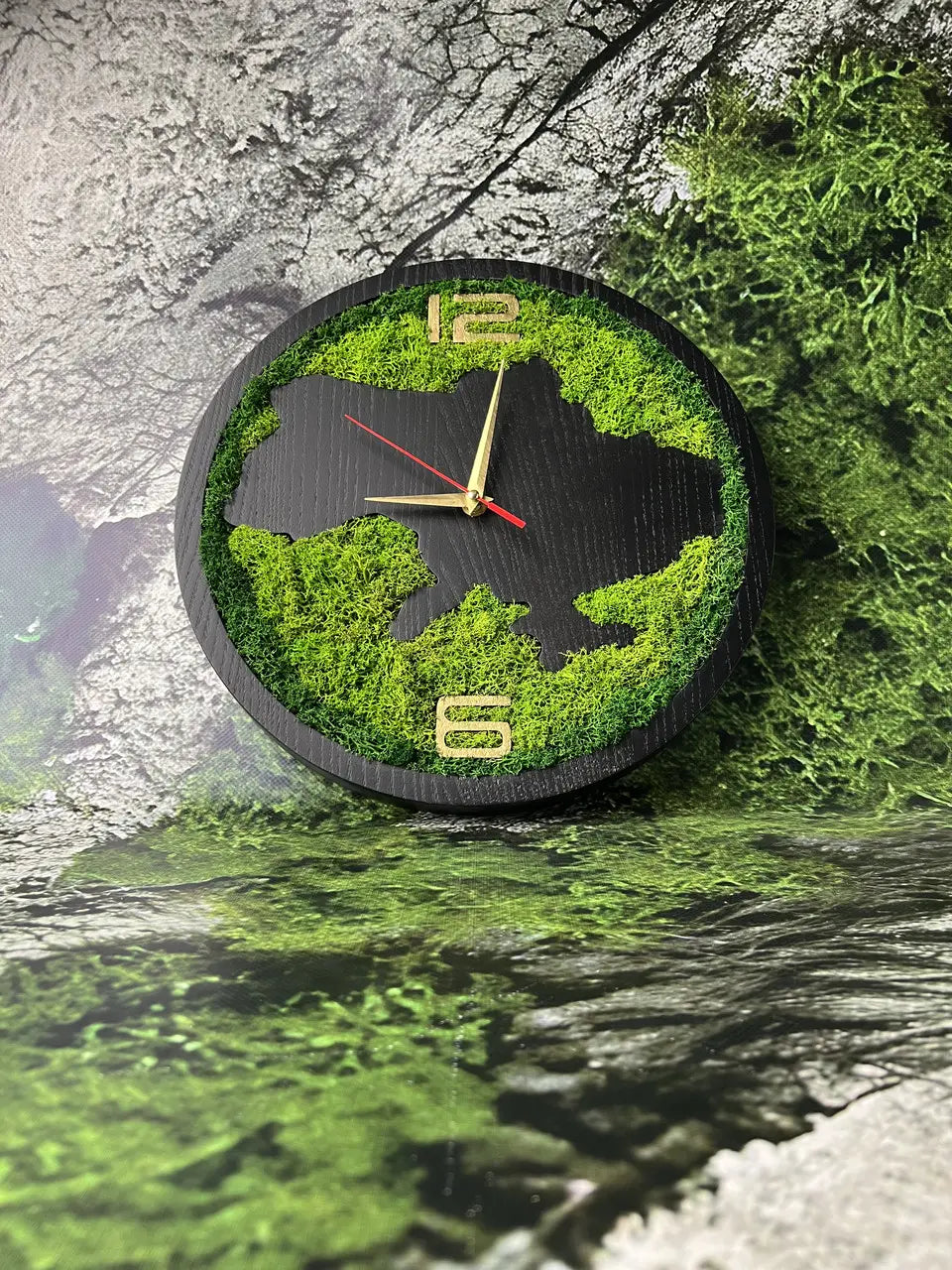 Handmade dark ash wood clock surrounded by preserved moss