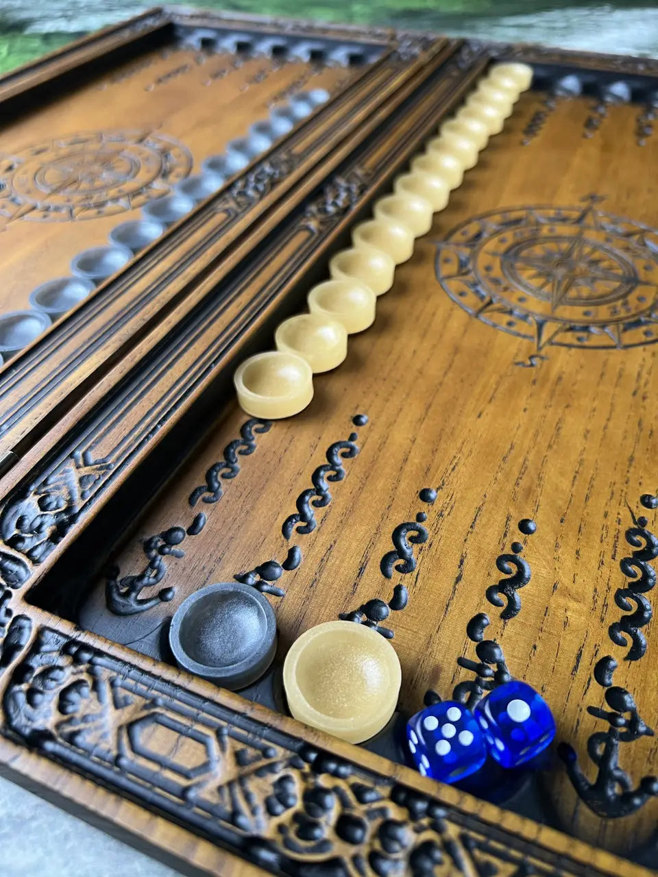 Open ash wood backgammon set with chips and dice