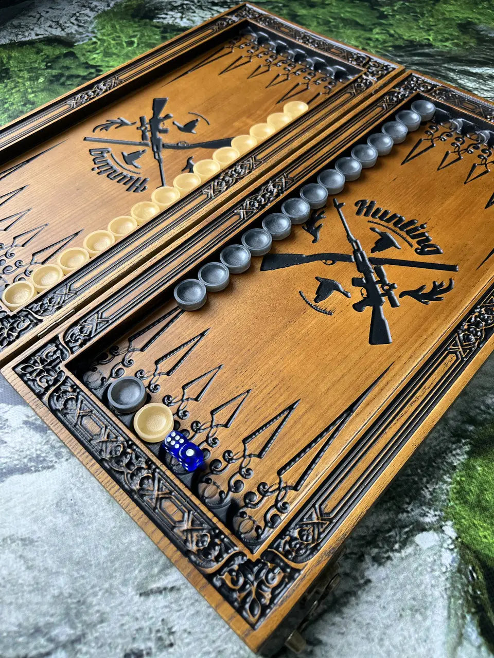 Decorative countryside hunting scene carved on backgammon case exterior