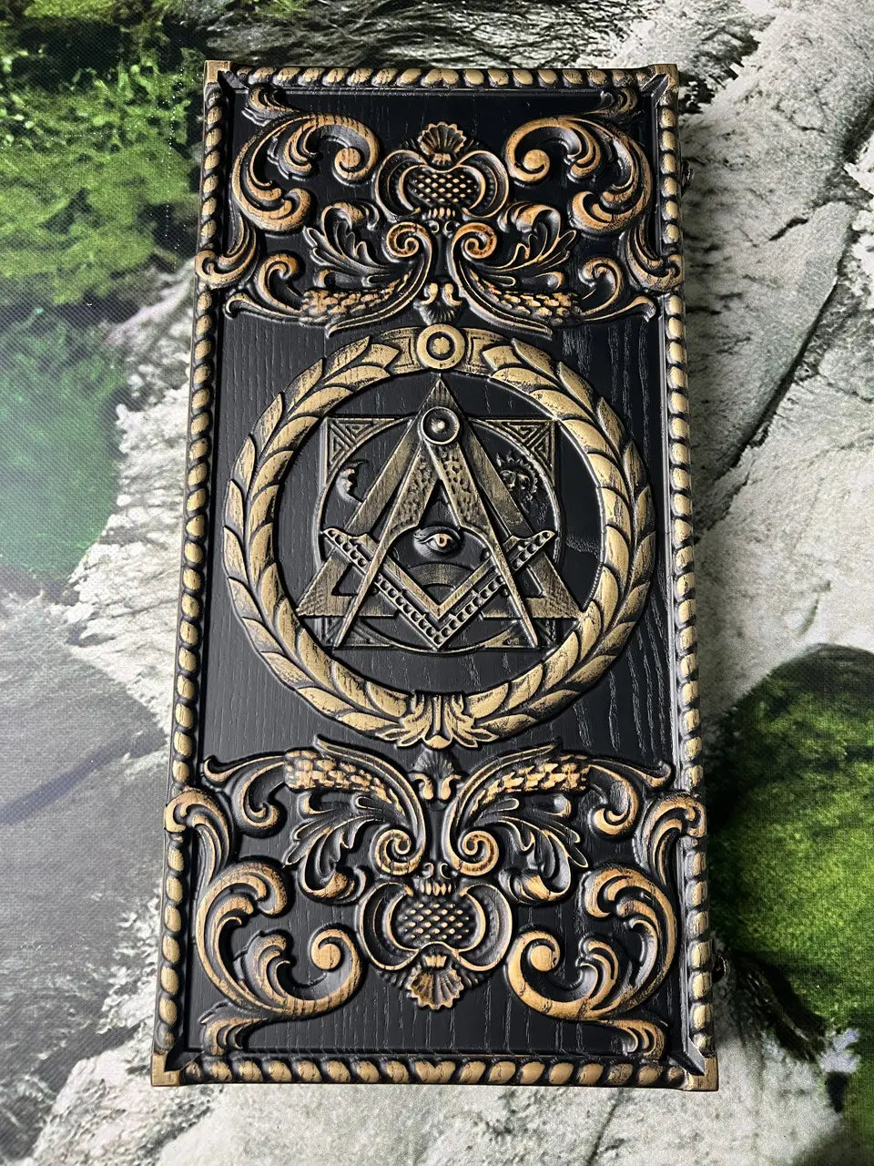 Detailed Masonic-inspired wood carving on handcrafted backgammon board
