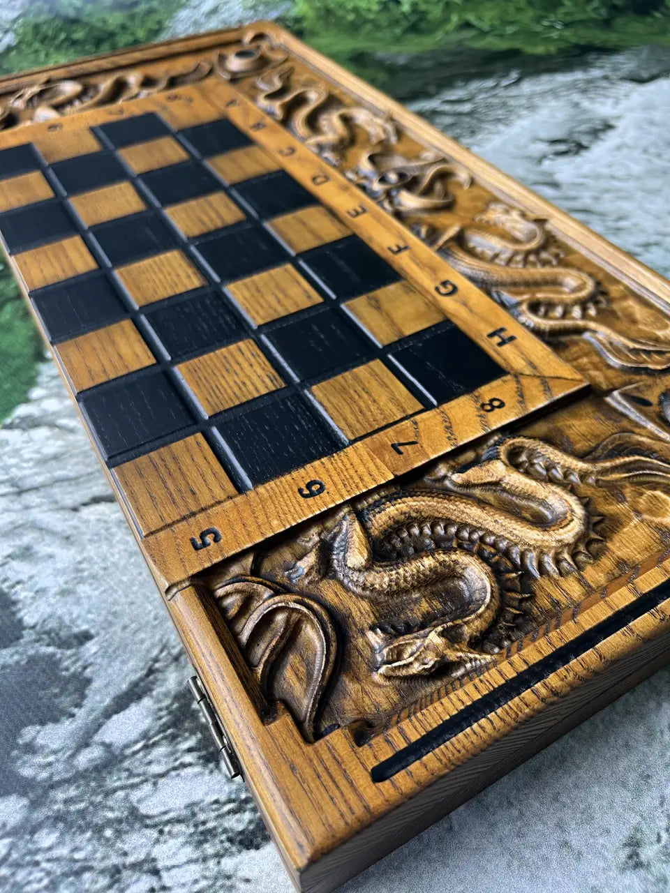 Detailed dragon carving on wooden chess and backgammon board
