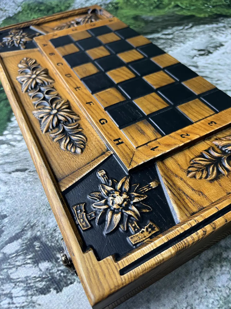 Detailed floral carving on handcrafted wooden chess backgammon board