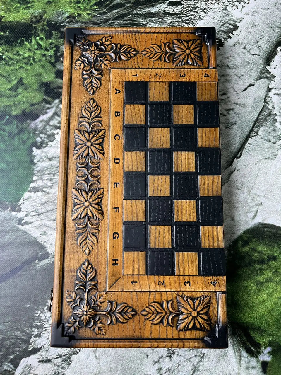 Handmade wooden backgammon board interior with carved pattern