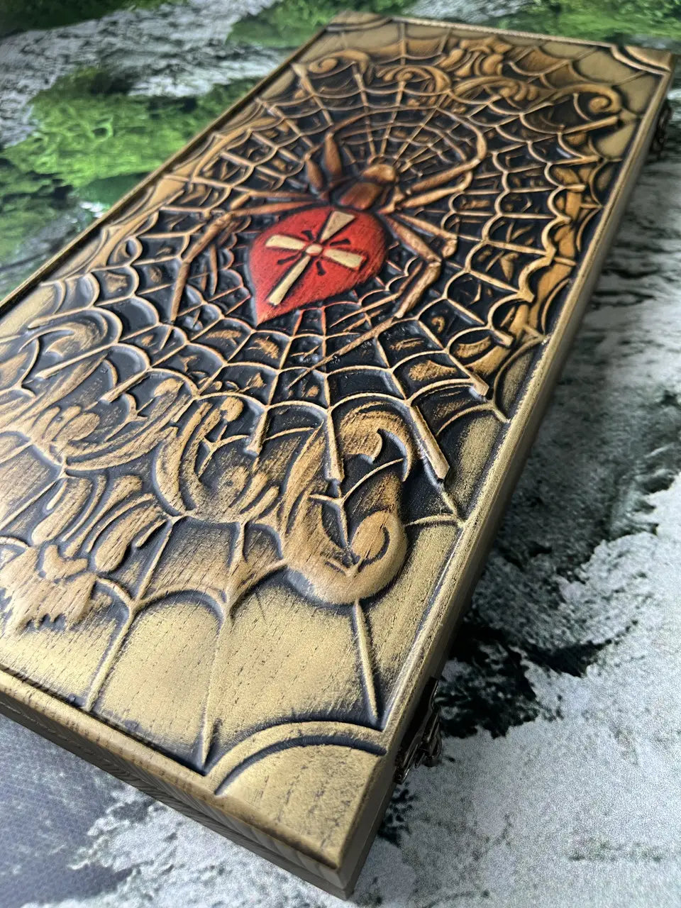 Wooden backgammon set with carved spider design and smooth playing surface