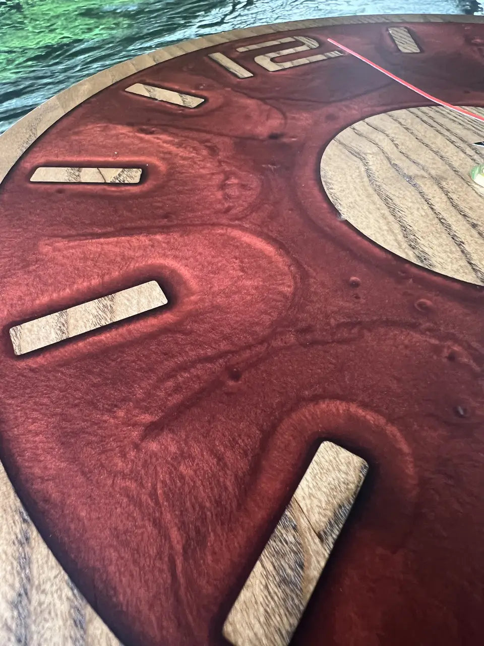 Round Wooden Wall Clock made from natural wood and red epoxy resin