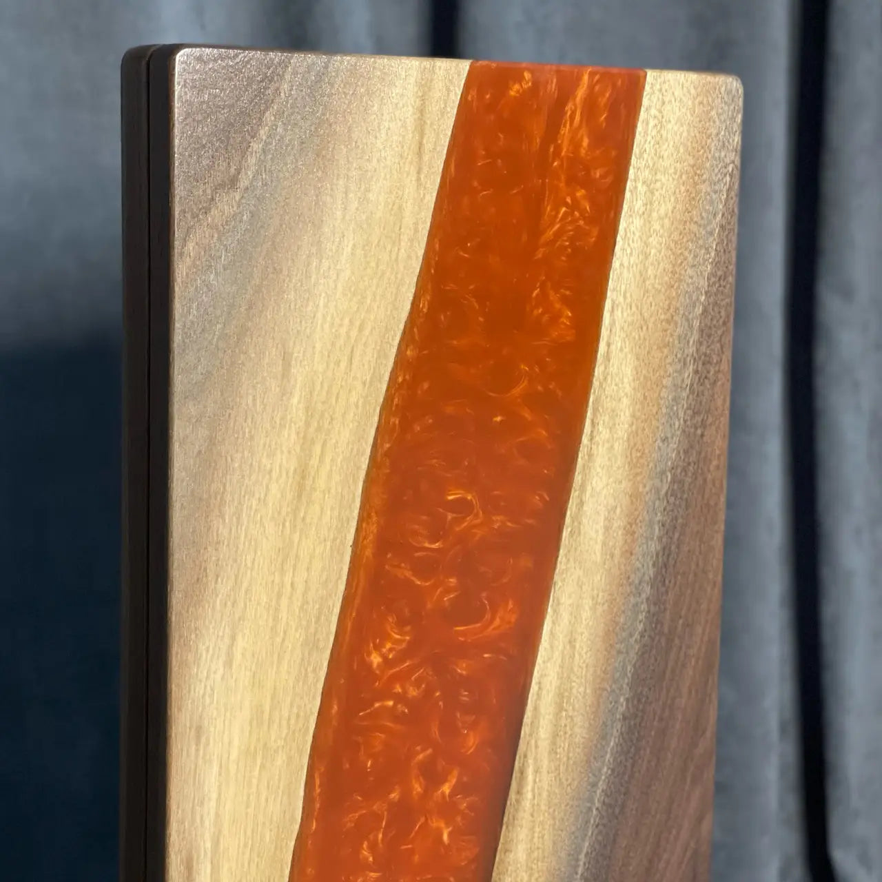 Natural oak grain and amber epoxy resin on handcrafted backgammon set