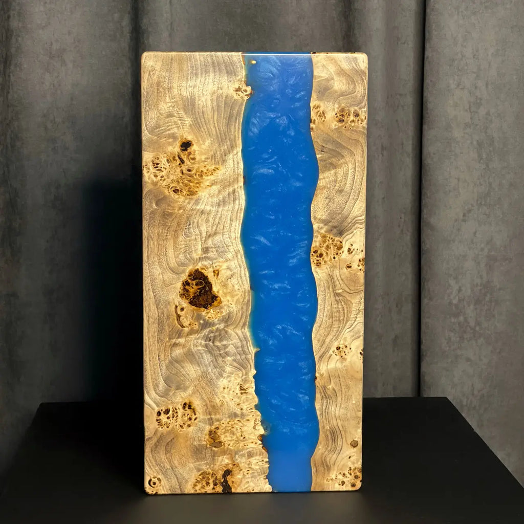 Close-up of burl wood and blue epoxy resin on handmade backgammon set