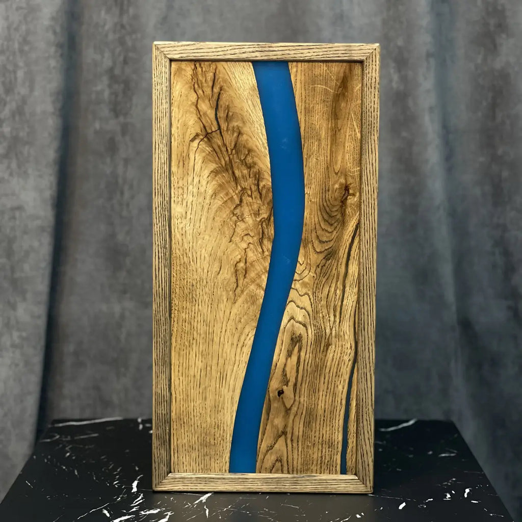 Close-up of natural wood grain and blue epoxy on backgammon board