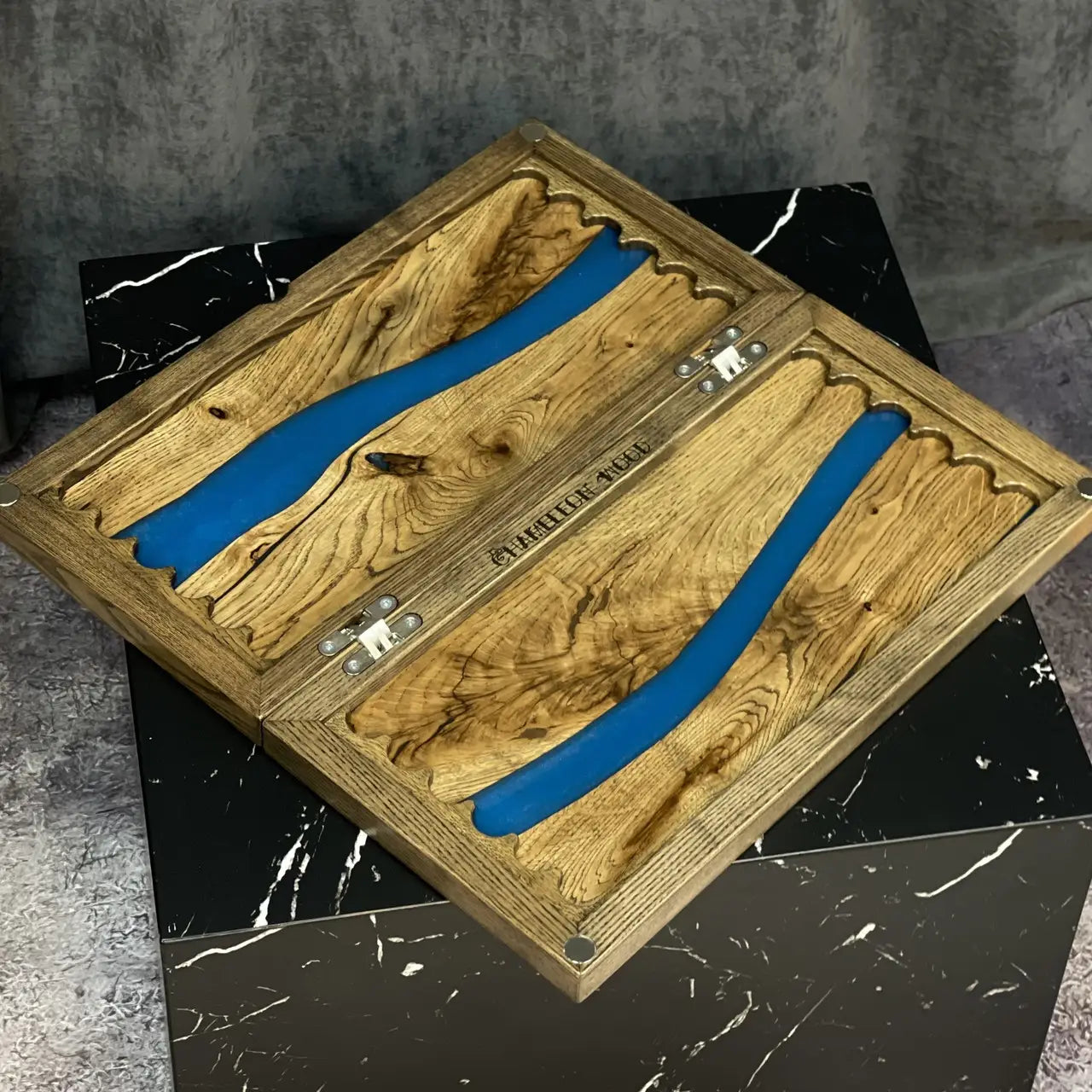 Closed Blue River backgammon set with natural wood grain and blue resin