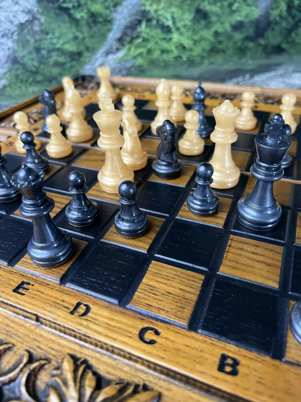 Black resin chess pieces with metallic shine, classic king and queen details