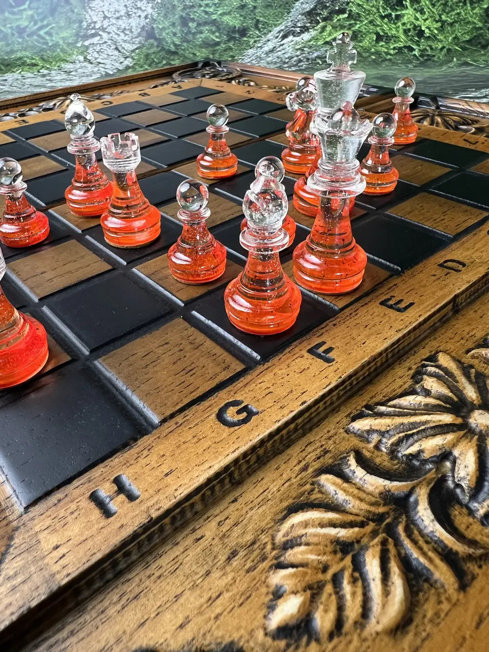 Close-up of red epoxy resin chess pieces with glossy finish