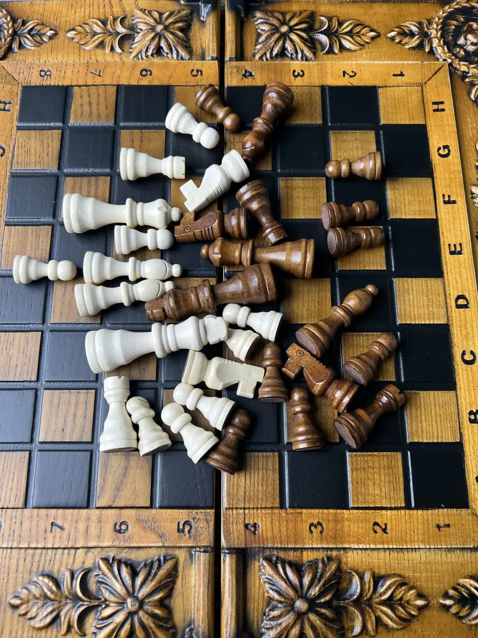 Detail view of wooden chess pieces on handcrafted chess board