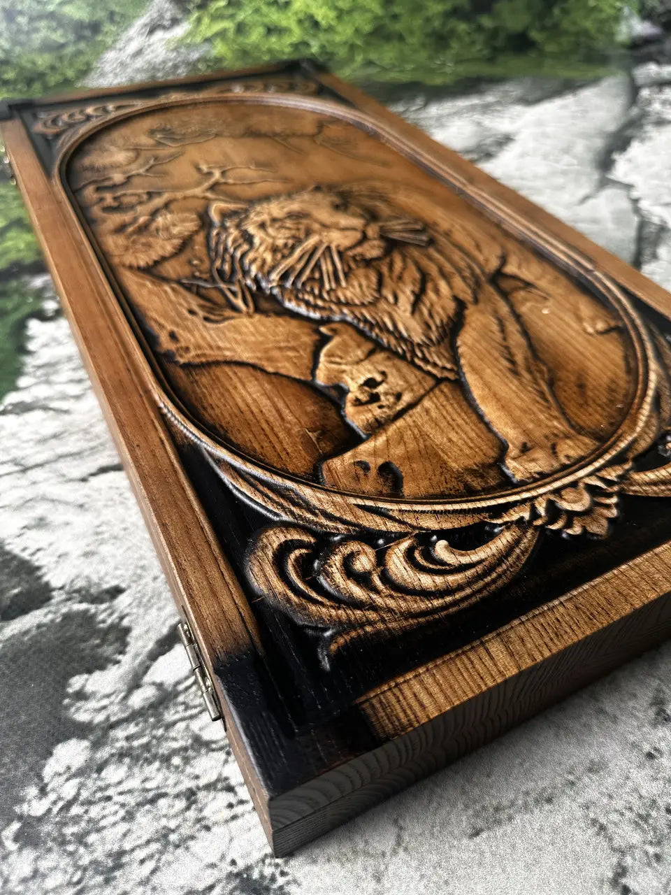 Open lion wooden backgammon board with playing pieces