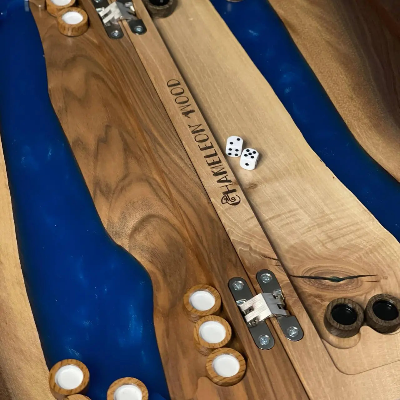 Close-up of Cobalt River backgammon board with wooden checkers, dice and blue resin