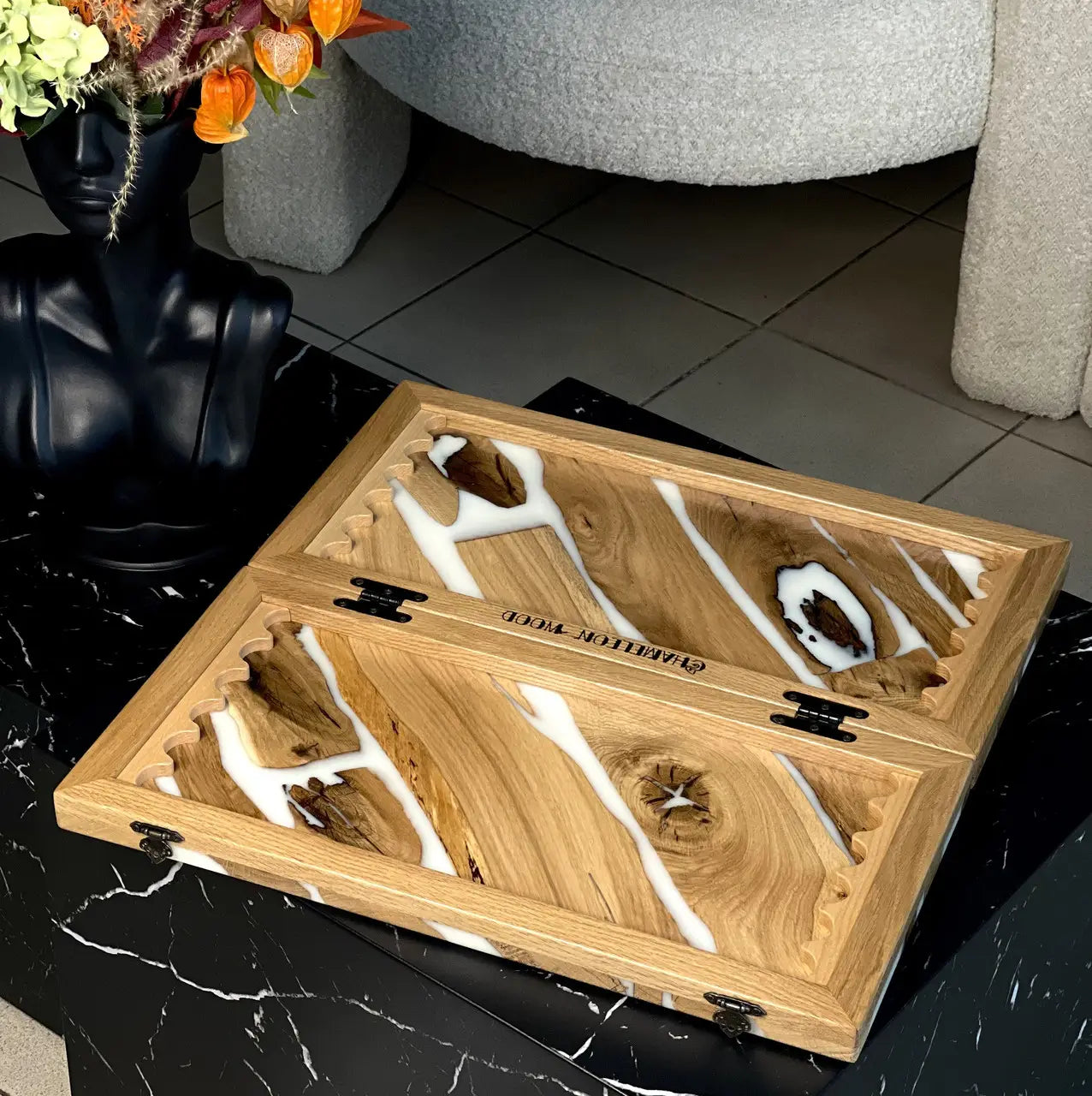 Close-up of Ivory River wooden backgammon board with checkers and white resin